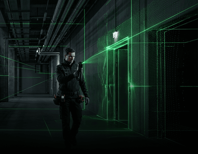 Surveyor using laser scanning equipment in an industrial facility